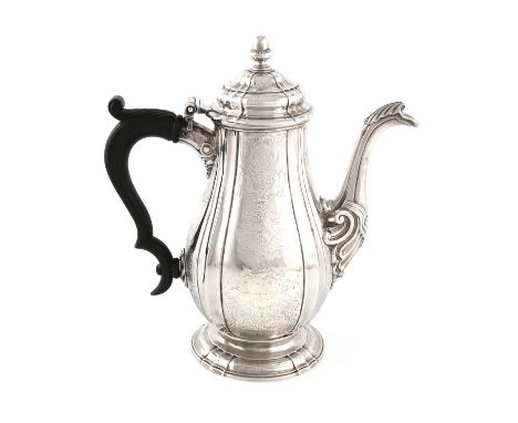 A George II silver coffee pot, by Charles Frederick Kandler, London 1728, ribbed and fluted baluster form, engraved with mask