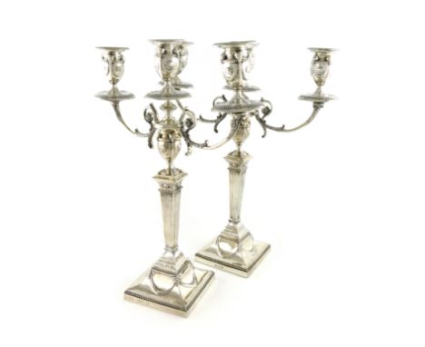 A pair of late Victorian silver three-light candelabra, by Walker &amp; Hall, Sheffield,1898, in classical manner, tapering f