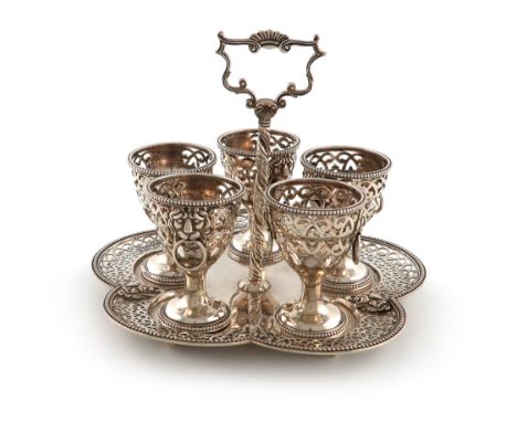 A Victorian silver five egg cup cruet stand, by George Fox, London 1865, hexafoil form, pierced foliate scroll decoration wit