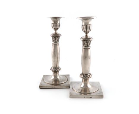 A pair of 19th century North European silver candlesticks, by K. Boiamowski, also marked 12, tapering columns, with foliate s