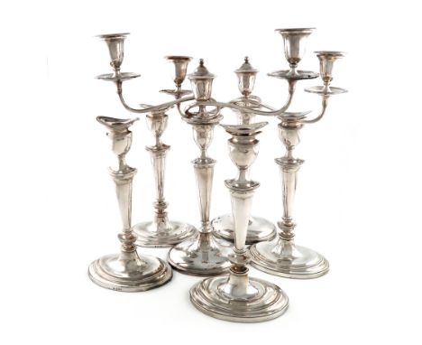 A pair of old Sheffield plated two-light candelabra, unmarked circa 1800, tapering oval form, plain scroll arms, each support