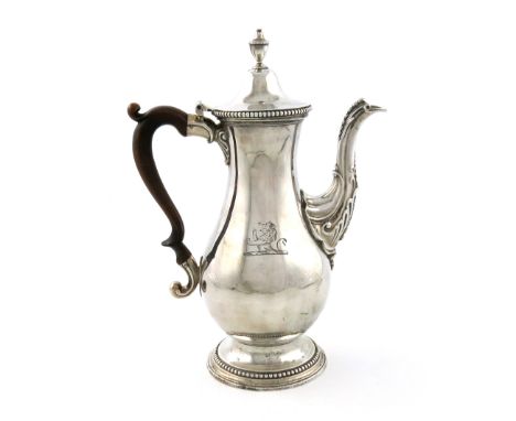 A George III silver coffee pot, by Daniel Smith and Robert Sharp, London 1776, baluster form, wooden scroll handle, domed hin