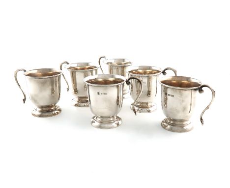 A set of six silver punch cups, by P H Vogel &amp; Co., Birmingham 1974, circular form, scroll handles, on raised circular ba