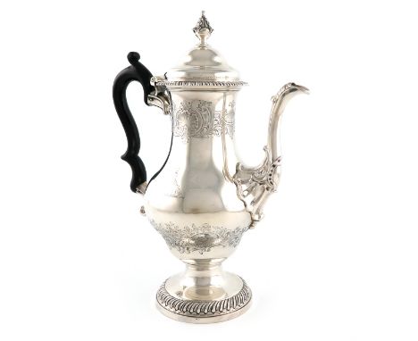 A George III silver coffee pot, maker's mark of L.H, not traced, London 1768, baluster form, scroll handle, chased shell and 
