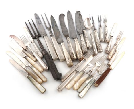 A collection of silver handled carving knives and forks and dessert eaters, various dates and makers, some with steel blades,