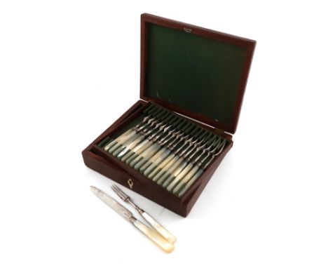 Please note catalogue amendment: one fruit knife is London 1803.A set of eighteen George III silver and mother-of-pearl handl