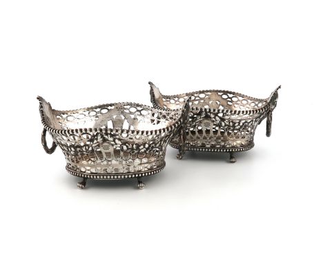 A pair of Victorian silver baskets, by Savory and Sons, London 1857, oval pierced form, with embossed foliate garlands, mask 
