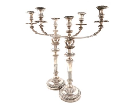 A large pair of George III silver and old Sheffield plate three-light candelabra, the silver columns by Matthew Boulton, Birm