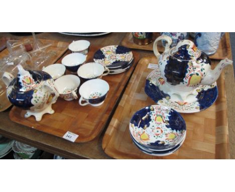 Two tray of 19th Century Gaudy Welsh 'Tulip' design to include: cups and saucers; lidded two handled sucrier; teapot and plat