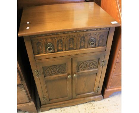 Reproduction oak carved record player cabinet.