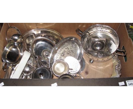 Tray of assorted metalware to include: various loose plated cutlery; silver plated tongs with claw handles; sauce boat on thr