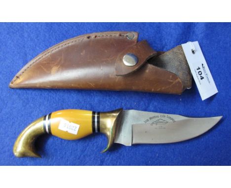 Iron Mountain Knife Company clip bladed hunting knife with brass and enamel shaped handle and leather scabbard.