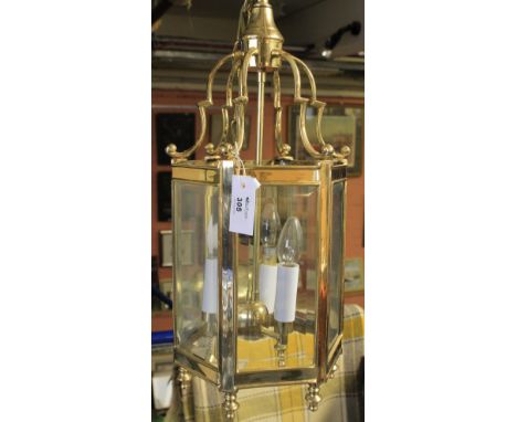 Modern brass hanging lantern ceiling light.