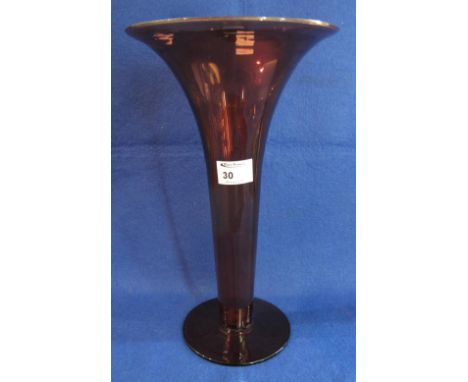Ruby glass flared trumpet vase on circular base.
