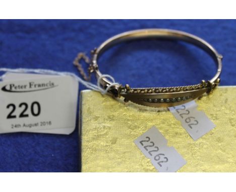 9ct gold bangle set with seed pearls in box. CONDITION REPORT: Bangle is split on one side of decoration near clasp. Otherwis
