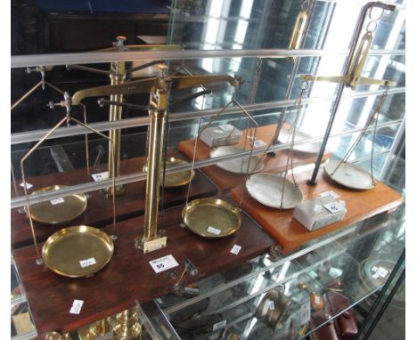 Set of brass chemical balance pillar scales by: W.L. Becker of Brussels, on wooden base, together with another similar and bo