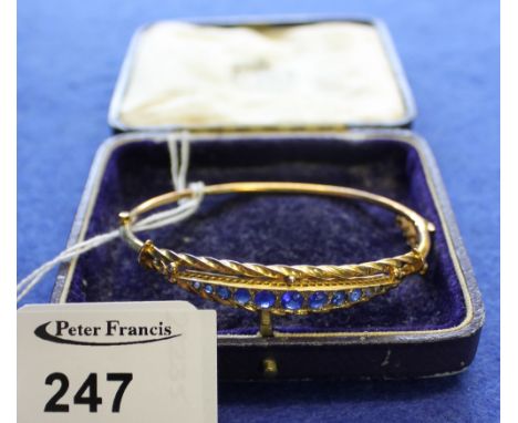 Victorian 9ct gold, blue stone bangle in box. CONDITION REPORT: Small dent to bottom of bangle otherwise no obvious damage. 