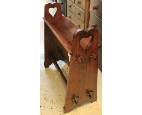 Early 20th Century oak Arts and Crafts design book trough with pierced heart carved decoration. CONDITION REPORT: Minor wear 