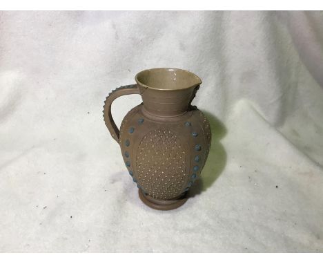 Doulton Silicon Lambeth 1882 ceramic jug with relief patterning. Small crack on neck. 