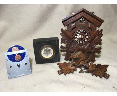 A box of clocks: including cuckoo clock, carriage clock, miniature 1930s style mantel clock, German mantel clock with slate s