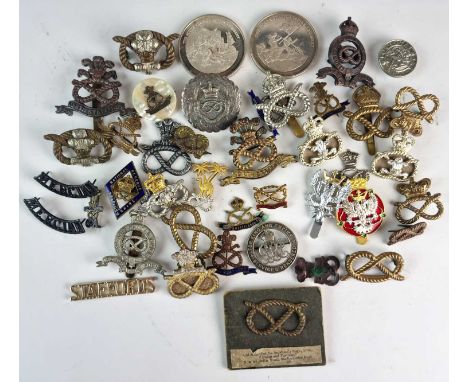 Two silver 'Great British Regiment' medals, North and South Staffordshire, together with Staffordshire shoulder titles, a sil