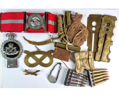A mixed assortment of militaria comprising "Duke of Wellington's Regiment" belt, ten ammunition rounds, rifle inspection clea