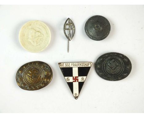 A group of German Third Reich women's badgescomprising a type-2 National Socialist Frauenschaft enamel badge (missing pin); a