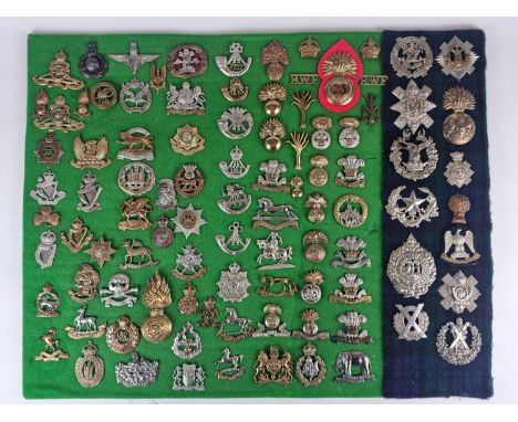A large collection of white metal and brass British army badges, approximately 100 - an assortment of originals and restrikes