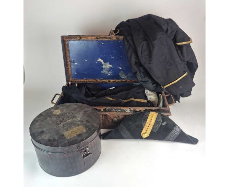 A small rectangular tin trunk containing a Naval Officer's or Court Uniform full dress tail coat, gilt buttons and piping, ma