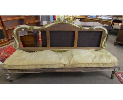 Parcel gilded and painted sofa, the arched back carved with ribbons, foliage and bird, also with a decorative frieze below (f