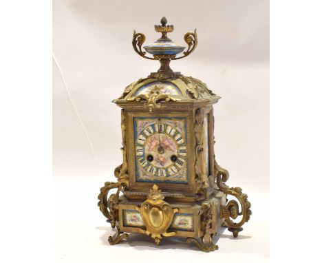 19th century French brass and Sevres (Paris) mounted mantel clock, crested with an urn finial over a rectangular face with ci