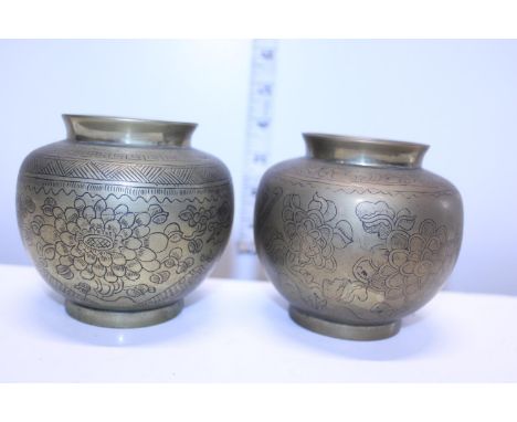 A pair of Chinese bronze censors with impressed marks to the base 