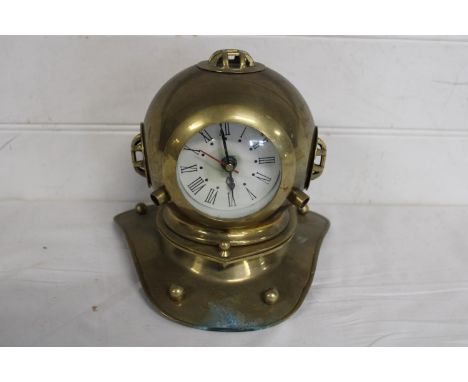 A novelty brass clock in the form of a divers helmet 