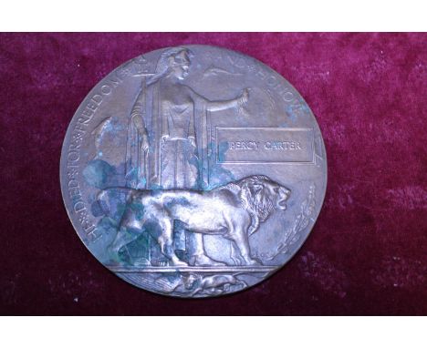 A WW1 bronze death penny awarded to Percy Carter 