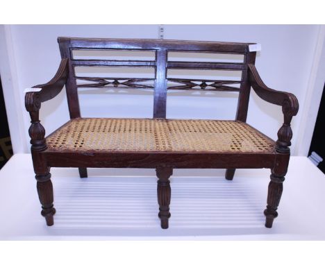 A antique child's bench with cane work seat. Shipping unavailable 