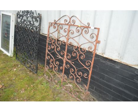 A wrought iron garden gate 