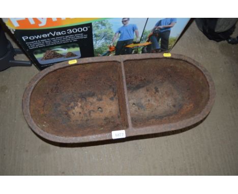 A cast iron trough 