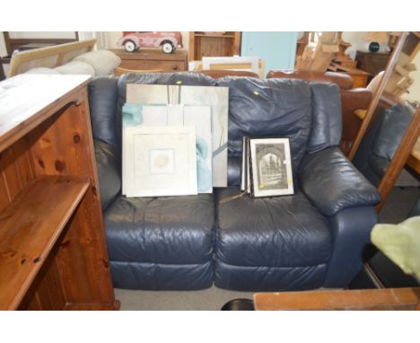 A black leather upholstered two seater reclining sofa