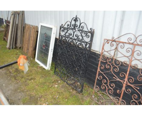 A wrought iron garden gate 