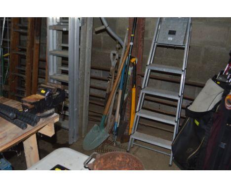 A quantity of long handled gardening tools