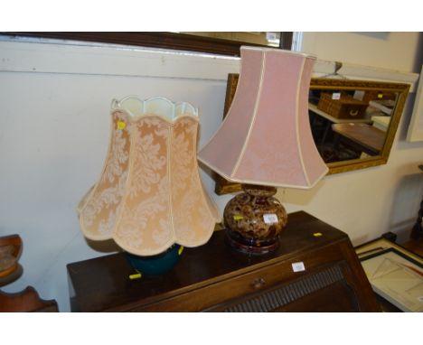 A pottery table lamp and shade and one other