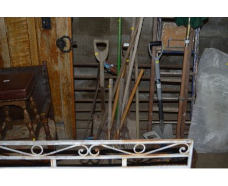 A large quantity of long handled gardening tools etc.
