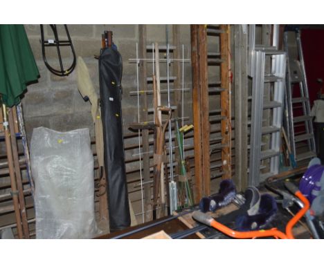 A quantity of gardening tools and a ladder etc.