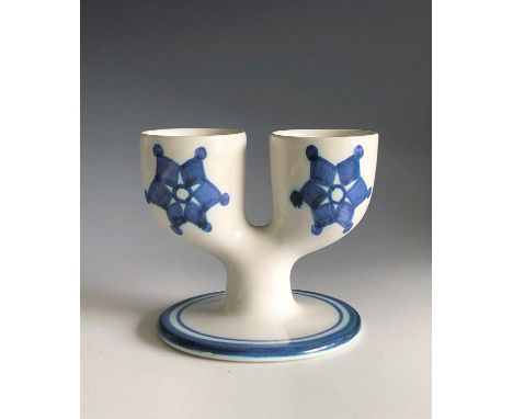 A white Troika pottery double egg cup with under glaze blue decoration, St Ives rubber stamp mark, height 9cm.Condition repor