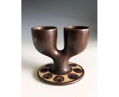 A brown glaze Troika pottery double egg cup, St Ives rubber stamp mark, height 9cm.Condition report: There are no real condit