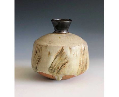 A Janet Leach vase, the ash glazed body with paw mark decoration, height 11cm, impressed makers marks and Leach Pottery seal.