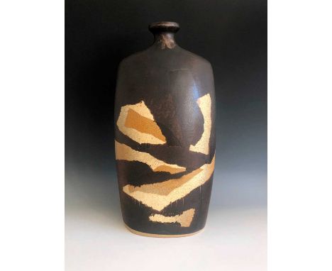 A Tremaen Pottery lamp base, height 42cm, with layers of abstract resist decoration.