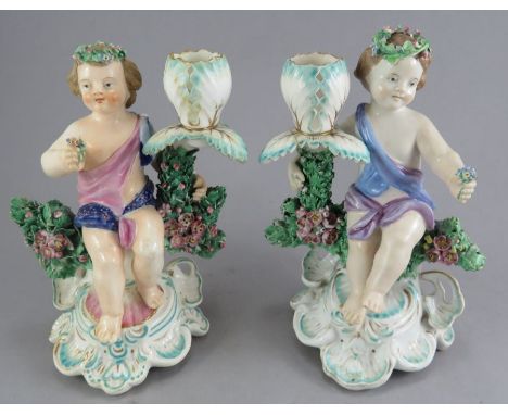 A Pair of Samson porcelain Candlestick figures of Cherubs 
Date late 19th century pseudo S&amp;H Derby mark
Size&nbsp;&nbsp; 