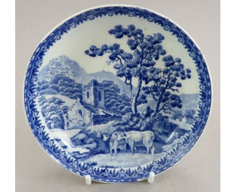 An uncommon early nineteenth century blue and white transfer-printed Spode Country Scene pattern saucer, c. 1820. It is unmar