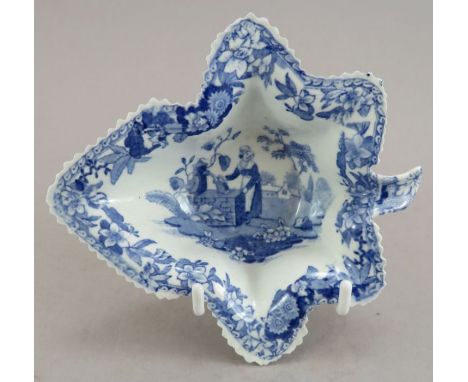 An early nineteenth century blue and white transfer-printed Spode Girl at the Well pattern leaf-shaped pickle dish, c. 1825. 